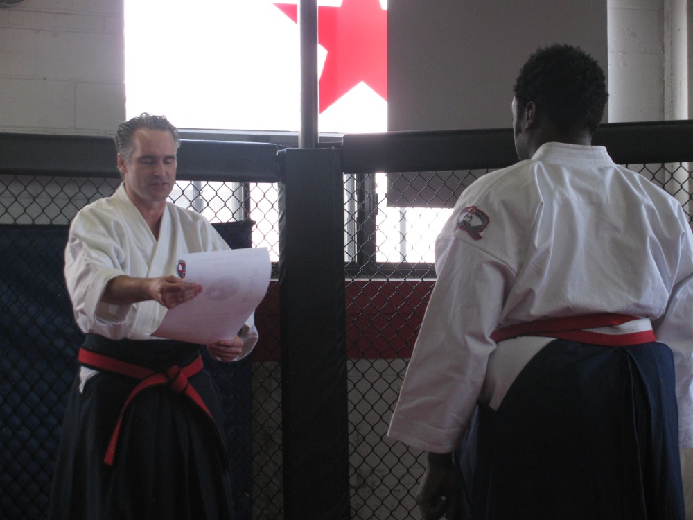 Shihan York Receiving the 6th Dan Diploma From Shihan Henderson