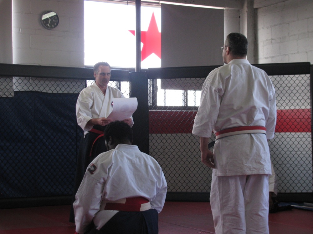 Shihan Hunter Is Presented The Godan (5th Degree) Diploma By Shihan Henderson Shihan Hunter Is Presented The Godan (5th Degree) Diploma By Shihan Henderson