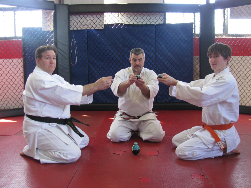 Sensei Choisnet, Shihan Hunter And Student Enjoy Kampai.
